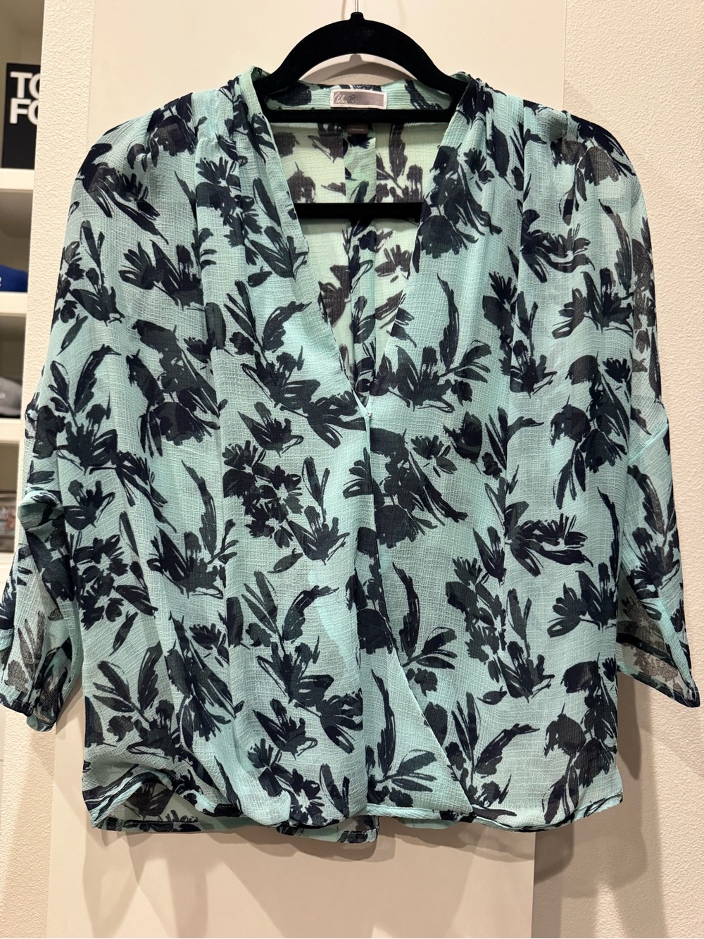 Chelsea28 light blue chiffon overlapping blouse featuring a dark blue